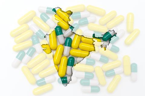 Map of India overlaid against an image of pharmaceutical capsules