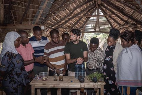 An image showing a group of people talking about plants