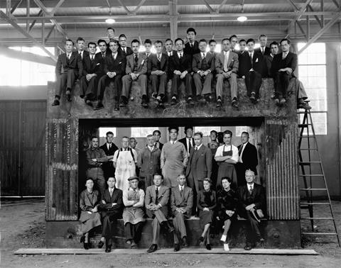 An image showing Lawrence Berkeley Laboratory's scientific and technical staff arranged within and on top of the magnet of the 60-inch cyclotron