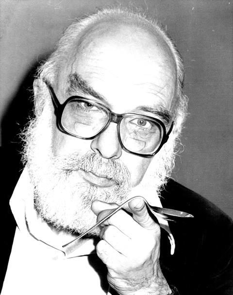 An image showing James Randi with a bent spoon