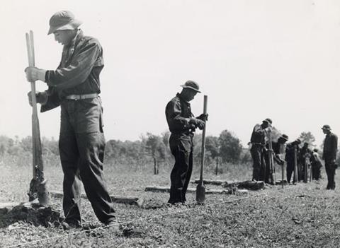 Civilian conservation corps (CCC) putting up a fence
