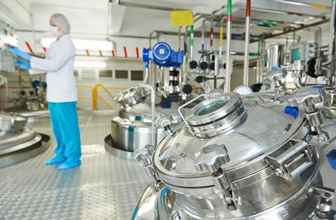 An image showing a pharmaceutical factory equipment mixing tank