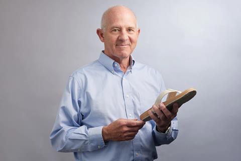 Stephen Mayfield holding a flipflop made of bio-based polyurethane