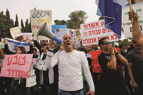 Teva employees demonstrating against the pharmaceutical company's plans to shed jobs