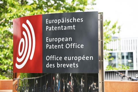 The outdoor sign for the European Patent Office. It is in German, English and French