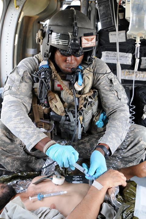 US Army medic in helicopter
