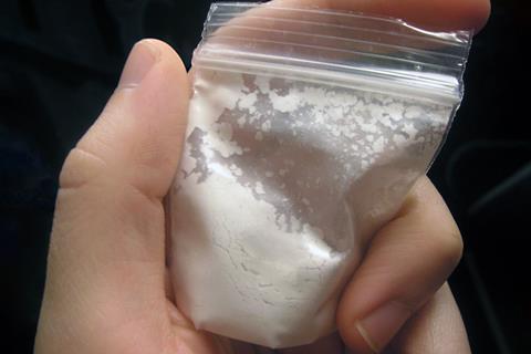 4-bromo-2,5-dimethoxyphenethylamine (2C-B) as a white power in a plastic bag