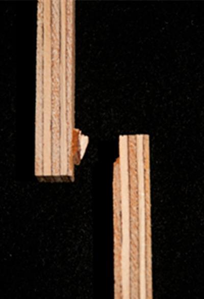 An image showing plywood substrates in which the joint created from a bovine serum albumin adhesive broke one adherend due to high adhesion strength