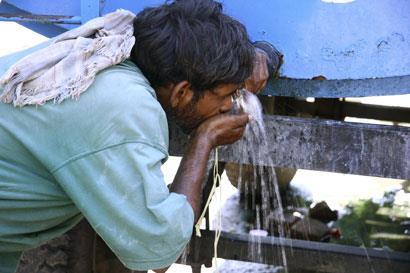 Indian-man-drinking-water_shutterstock_Paul-Prescott_410