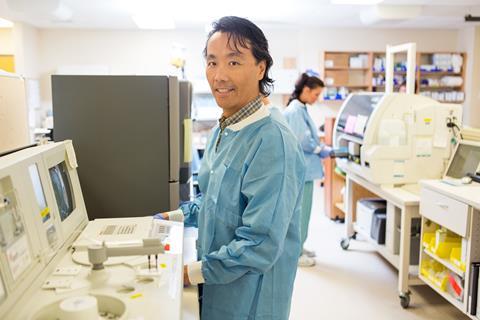 A photograph of two scientists working in a laboratory