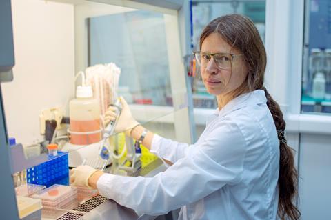Researcher at a fume hood