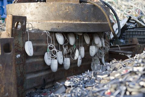 An image showing computer mice in a landfill site