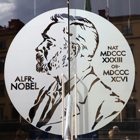Portrait of Alfred Nobel on the glass door of Swedish Academy and Nobel Museum in Stockholm