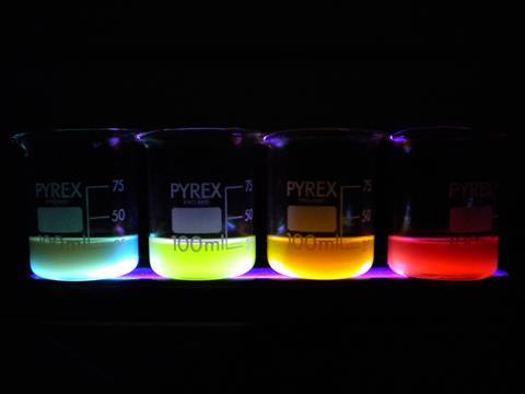 colourful polymer nanoparticles in beakers