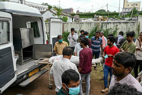 Authorities return the body of a victim of the explosion to family