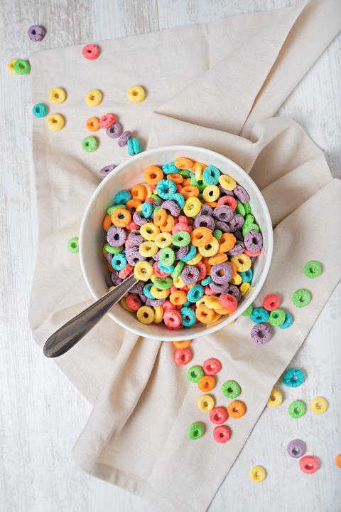 Bowl of colourful cereal on a white table
