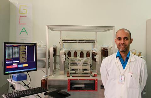 Ahmed Elmouna with the oligonucleotide synthesiser