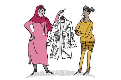 An image showing a scientist showing a lab coat to another scientist