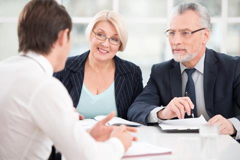 A photograph of a panel interviewing a PhD candidate