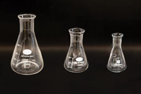 An image showing three conical flasks in decreasing size