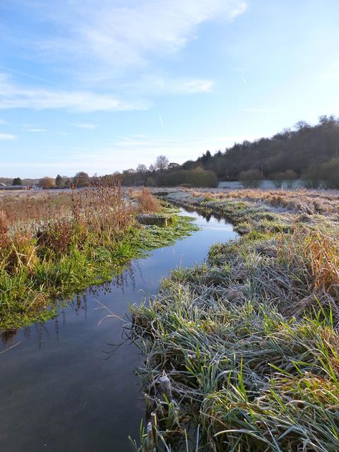 A photo of a river in a frosty landscape