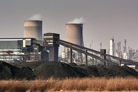 Sasol's Secunda plant, with piles of coal in the foreground