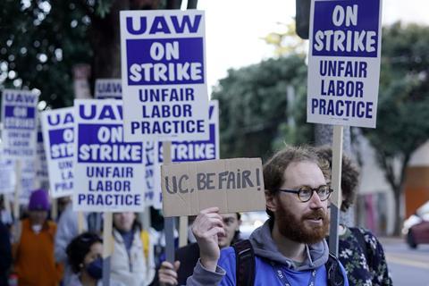 People on a protest. Their placards read UAW on strike.