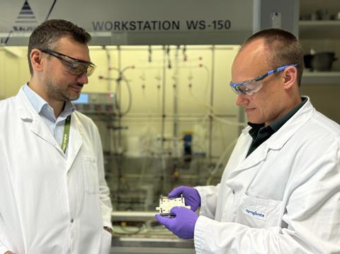 Andrei Iosub and Matthias Lehmann hold a flow cell reactor