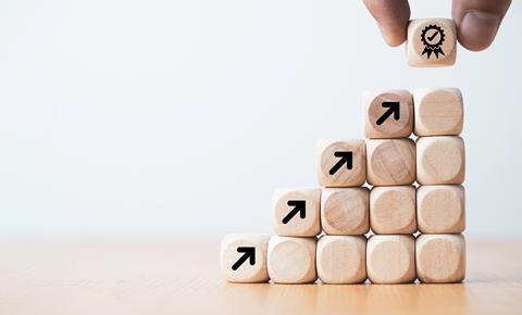 Wooden blocks showing steps to success