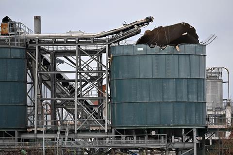 A photo showing the damage to a silo following an explosion