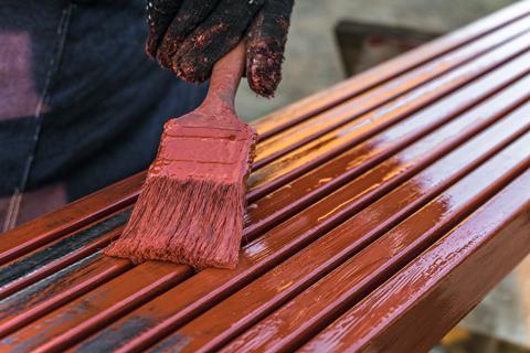 Painting metal surfaces with protective red paint