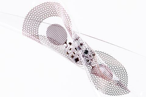 'epidermal’ electronic device, twisted in a way that illustrates the soft mechanical properties and the partial optical transparency