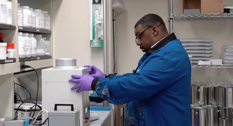 An image showing an AST engineer mixes a SLIPS coating formulation