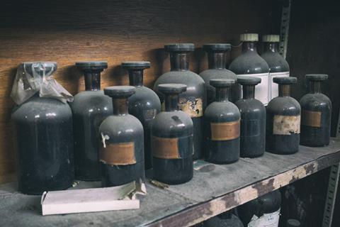 Antique, dusty chemical bottles