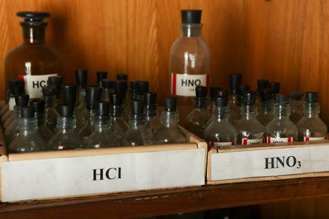 Bottles of HCl and HNO3
