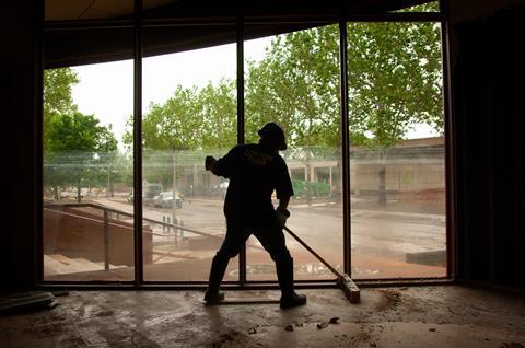 Man cleaning after a flood