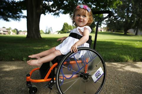 An image showing a child with spinal muscular atrophy