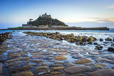 Dusk on the causeway leading to St Michaels Mount off the coast of Marazion Cornwall England UK