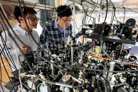 Zhendong Zhang (left) and Cheng Chin in the laboratory