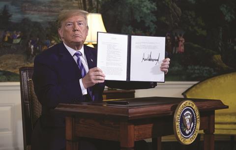 President Trump holding National Security Presidential Memorandum