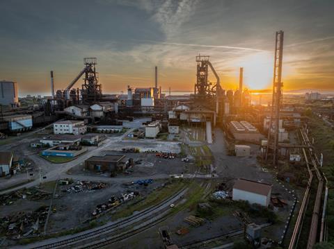 Tata Steel in Port Talbot, with the sun setting behind