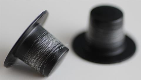 Artificial spider silk fibers on spools