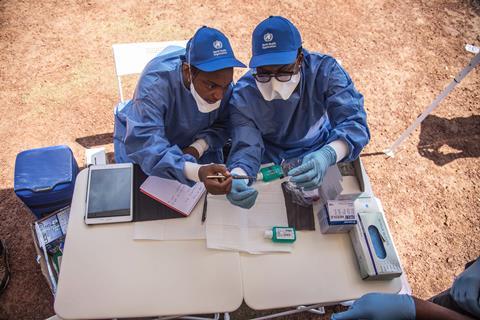 An image showing nurses preparing to administer vaccines