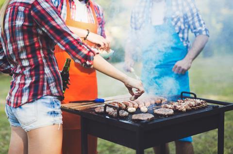 Friends enjoying a barbecue grill