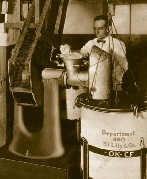 An old photo of a man working in an industrial setting