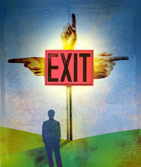 Man in front of a sign pointing three different ways to Exit