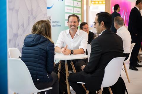 A group of professionals networking at a conference