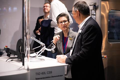 Professionals discussing equipment at an exhibition