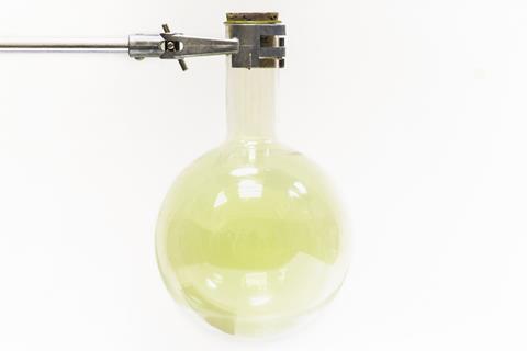 Chlorine gas in a glass round bottom flask