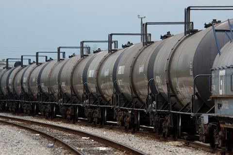 A line of oil rail tankers on a track